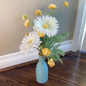Decorative faux flowers and vase